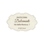 Etichetta ovale bianca con scritta dorata “Il Cantuccio” e spiga di grano stilizzata, indicante specialità di biscotti artigianali e indirizzo a Pisa.